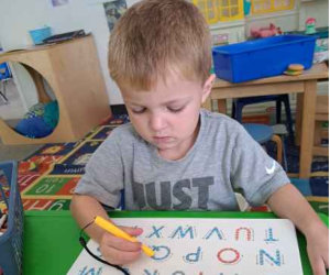 little boy writing